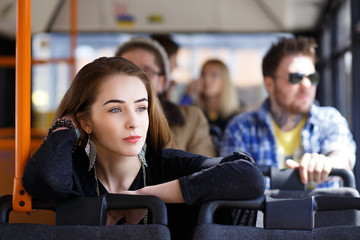 people in the bus. she wondered transport.