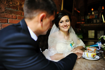 Smiling cute bride looking at her groom