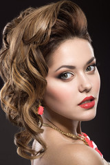 Beautiful girl with evening hairstyle and bright makeup © Kobrinphoto