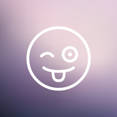 Happy winking emoticon with protruding tongue thin line icon
