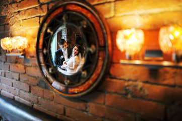 weddin couple on a circle mirror