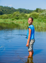 Girl fishing on the river.