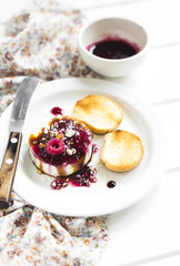 goat cheese with berry sauce, balsamic vinegar and nuts