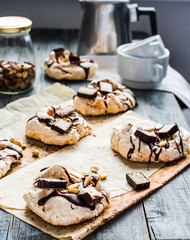 meringue with chocolate, caramel and nuts, sweet dessert