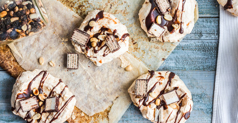 meringue with chocolate, caramel and nuts, sweet dessert