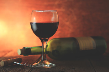 Wine glass and Bottle on a wooden background