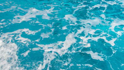 Boat Wake Prop Wash in Clear Blue Ocean Sea in Sunny Day