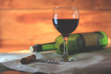 Wine glass and Bottle on a wooden background