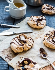 vanilla meringue with chocolate, caramel topping and nuts, sweet