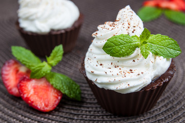 Chocolate cupcakes with strawberry and cream