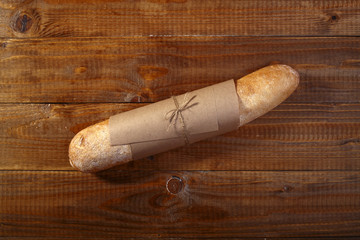 Loaf of french bread in paper packet