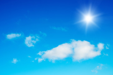 Naklejka na ściany i meble Blue sky,white clouds and sun.