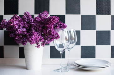 lilacs in a vase and glasses