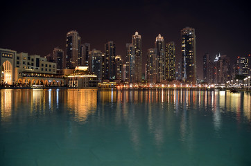 Obraz premium city building at night and water reflect photo