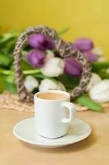 tulips on the table with cup of caffee