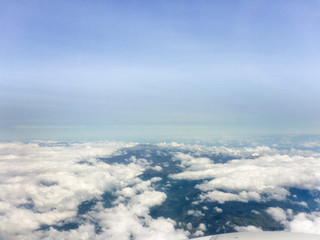 Fototapeta na wymiar Clouds and Mountains from Window Plane
