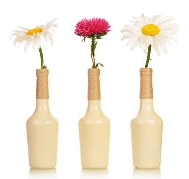 Three Flowers In Vases