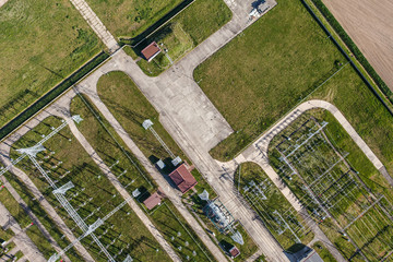 Aerial image of electrical substation featuring wires, transform