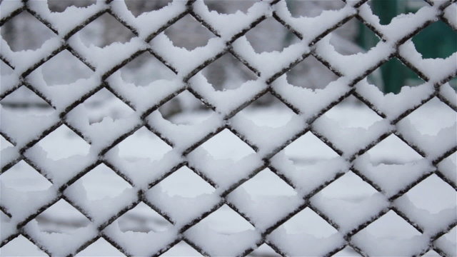 winter fence in the snow