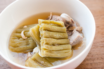 Bitter Gourd Soup with Pork in a Bowl on Wood Table