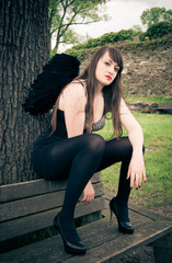 Woman with black angel wings