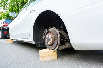 Car with stolen wheels