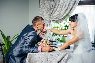 Fototapeta premium Charming bride and groom on their wedding celebration in a