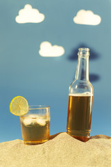 Image simulating hot summer scenery with fresh drink with cutout clouds