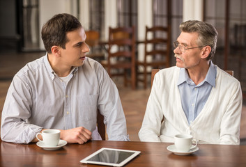 Businessmen in cafe