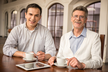 Businessmen in cafe
