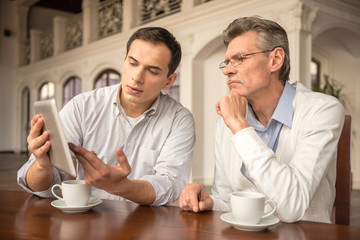 Businessmen in cafe
