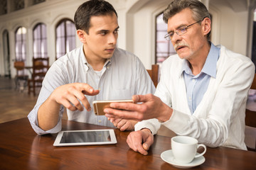 Businessmen in cafe