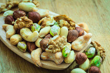 Varieties of nuts: cashew, pistachio, almond.