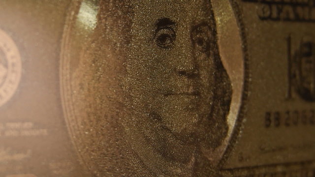 Franklin image on a rotating Gold Dollar