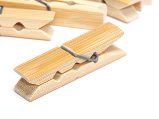 Wooden clothes pin isolated on white background