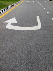 Arrow signs as road markings on a street