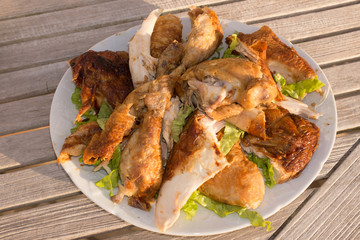 Piece of Roast chicken under wooden background
