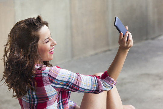 Teen girl taking a selfie and winking