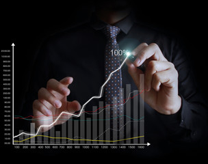 Man drawing a growing graph