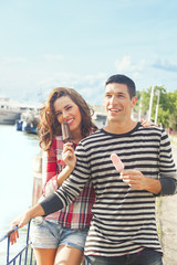 Fototapeta na wymiar Young couple eating ice cream on a sunny day