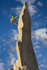 Climber rappelling from the summit.