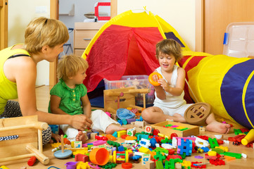 Mother and children playing