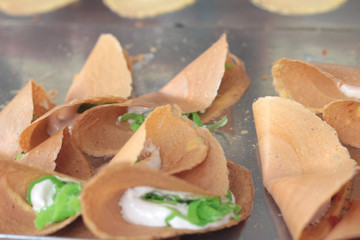 close up of thai crispy pancake - cream crepes