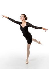 Young ballet dancer in arabesque pose