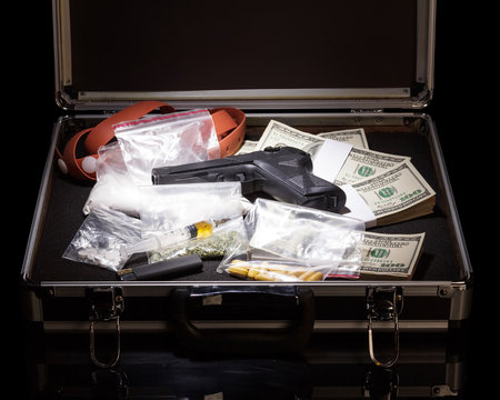 Case with money, gun and drugs
