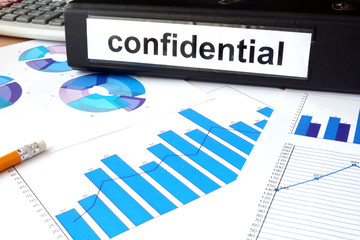 Folder with the label confidential and charts