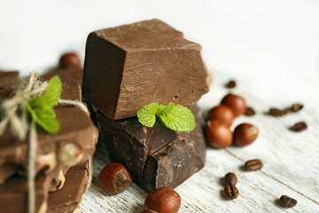 Set of chocolate on wooden table, closeup