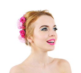 Fototapeta premium Portrait of young woman with flowers in hair isolated on white