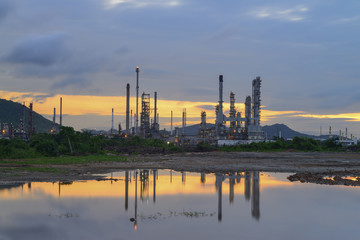 Oil refinery along reflection