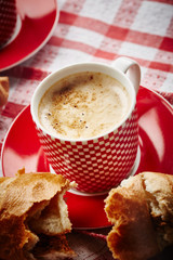 Cup of coffee with croissant